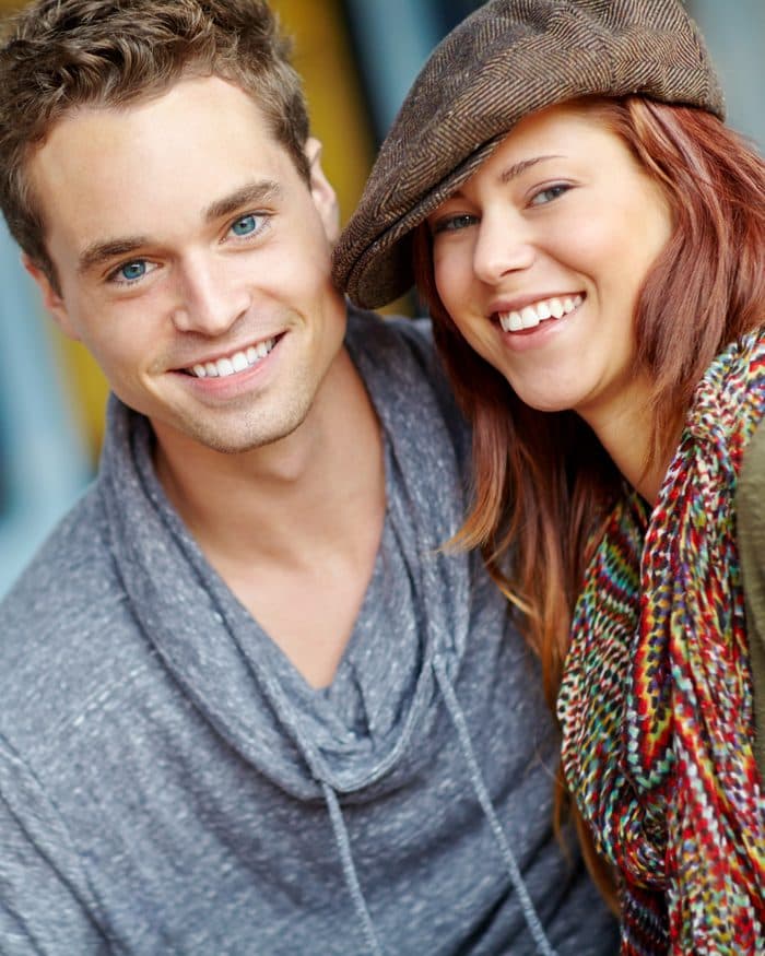 A smiling couple leaning together